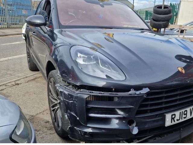 Porsche Macan with front bumper and bonnet damage, before repair