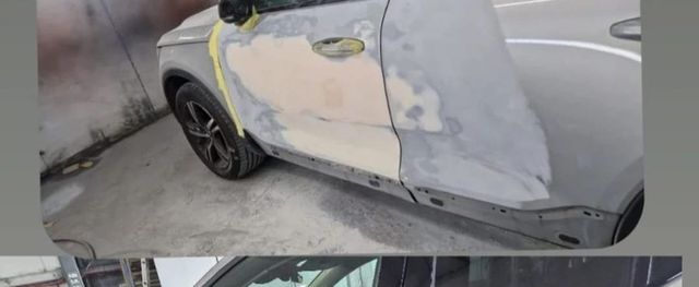 Silver SUV with primed rear door before respray