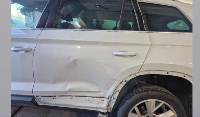 Skoda estate with dented rear door and quarter panel, before repair