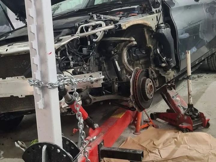 Car on the chassis alignment jig during accident repair