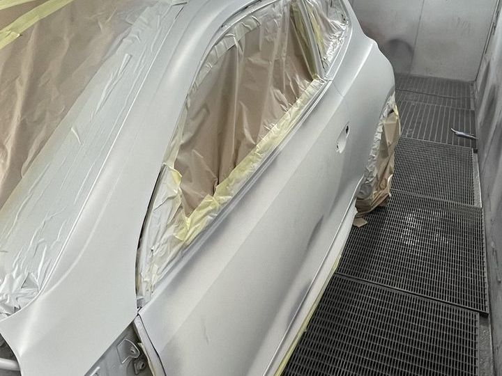 Car masked up in the spray booth ready for respray